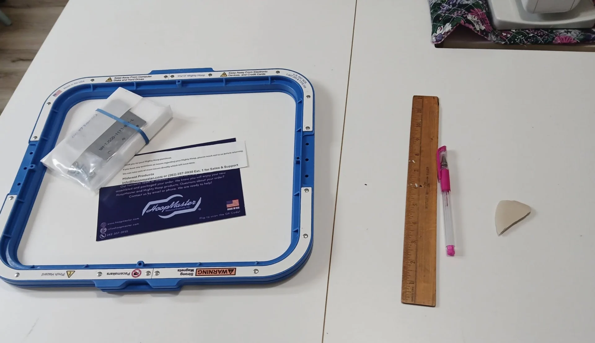 Embroidery frame and tools on table